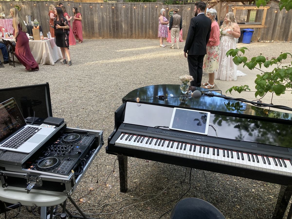 Wedding reception with DJ controller and digital grand piano setup